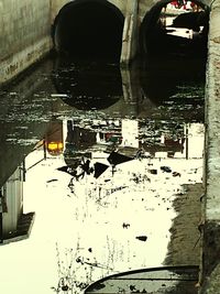 Reflection of buildings on puddle