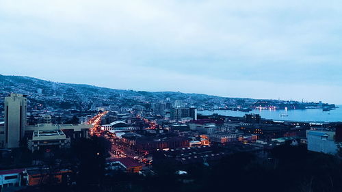 High angle view of illuminated cityscape against sky