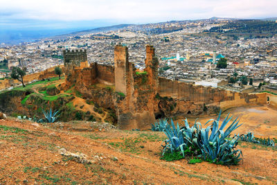 High angle view of old built structure against cityscape at fes el bali