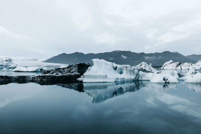 Scenic view of frozen lake against sky