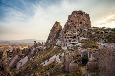 Old ruins of building against cloudy sky