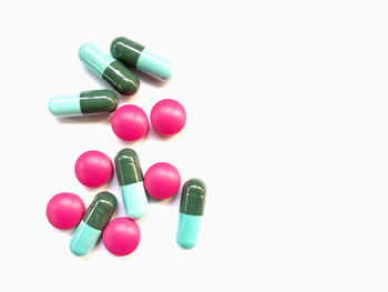 Close-up of multi colored pencils over white background