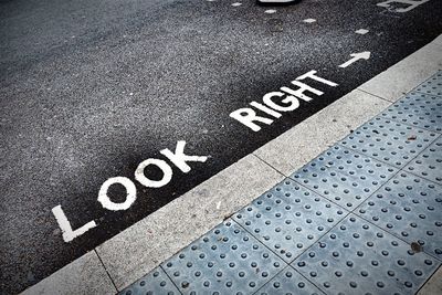 High angle view of arrow symbol on road