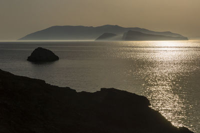 Scenic morning view of santorini from folegandros island  against clear sky