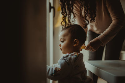 Mother and daughter looking at camera