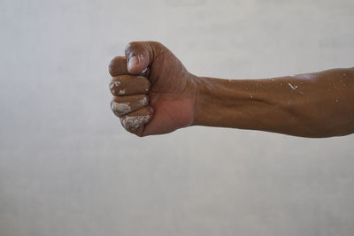 Close-up of hand against white background