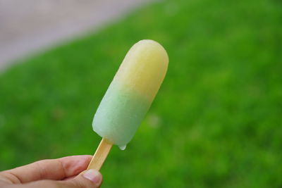 Hand holding ice cream cone