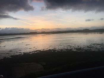 Scenic view of sea against dramatic sky