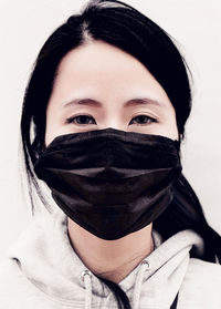 Portrait of a teenage girl covering face