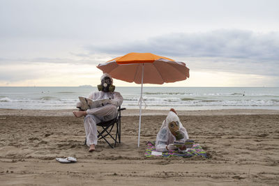 People at beach in a postapocalyptic scene 