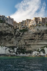 View on the old town of bonifacio from boat on the cliffs, scenic view of sea against sky