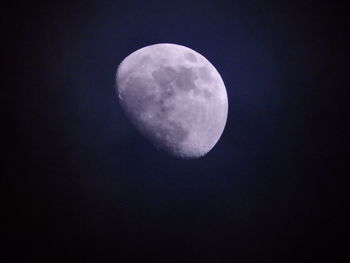 Low angle view of moon against clear sky at night