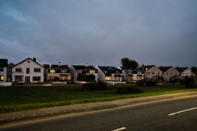 Cars on road against sky