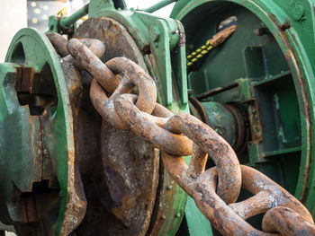 Close-up of rusty metal chain on machinery