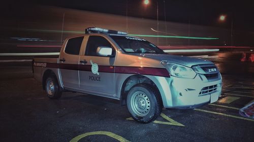 Car parked on road at night