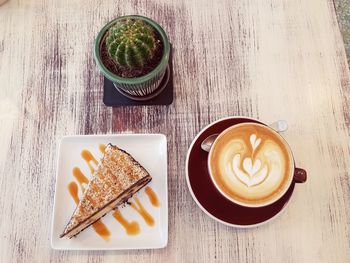 High angle view of coffee served on table