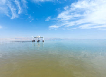 Luxury tourist resort at the dead sea, israel with sun umbrella floating on the water