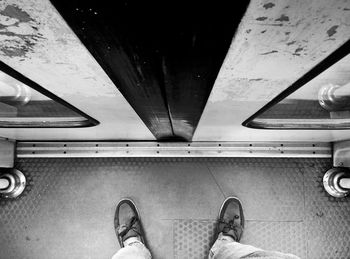 Low section of woman standing on tiled floor