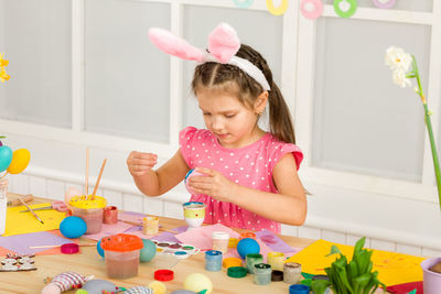 Portrait of boy playing with toys on table