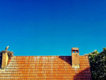 Low angle view of building against blue sky