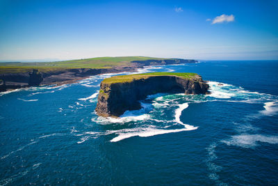 Aerial view of a rocky islet off the shore of kilkee cliffs. 