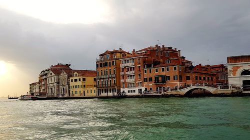 View of buildings against cloudy sky