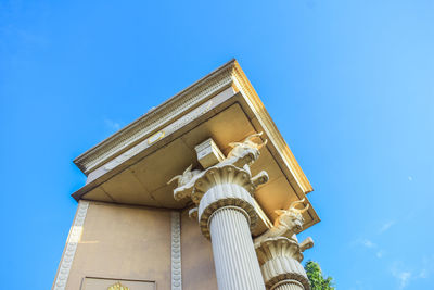 Low angle view of traditional building against blue sky