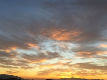 Low angle view of dramatic sky during sunset