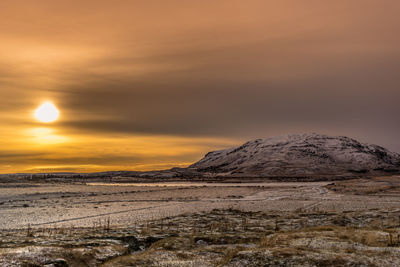 Scenic view of landscape against sky during sunset