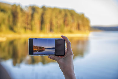 Man photographing with mobile phone