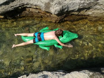 Boy swimming in water