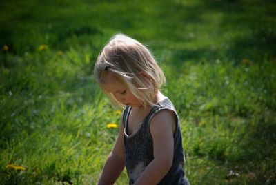 Side view of woman standing on field