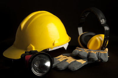 Close-up of yellow hat on black background
