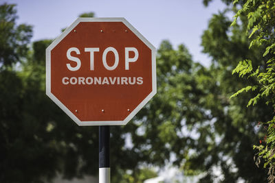 Photo of a stop sign reading stop coronavirus