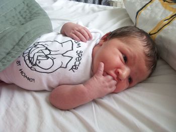 Close-up of baby on bed