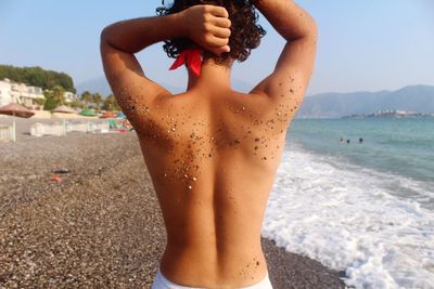 Woman standing on beach