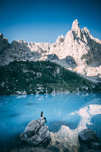 Scenic view of snowcapped mountain against blue sky