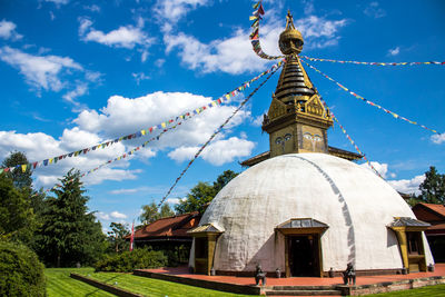 View of temple against cloudy sky