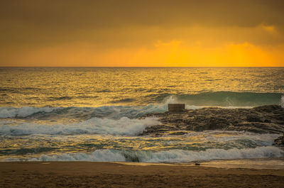 Scenic view of sea against sky during sunset