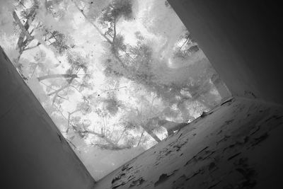 Scenic view of snowcapped mountains seen through window