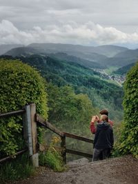 Scenic view of mountains against cloudy sky