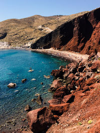 Scenic view of sea and mountains against sky