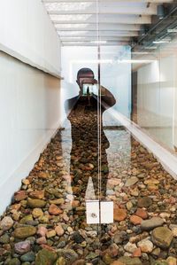 Reflection of man on glass door