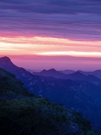 Scenic view of mountains against sky during sunset