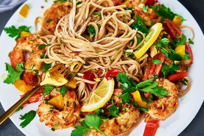 Stir fry noodle with shrimps, asian cuisine, cooked soba