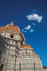 Low angle view of building against blue sky