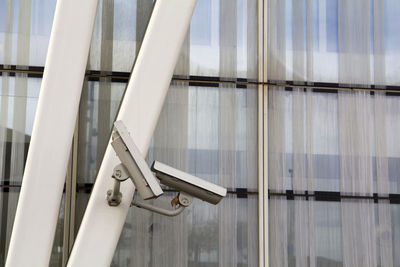 Low angle view of security cameras on building