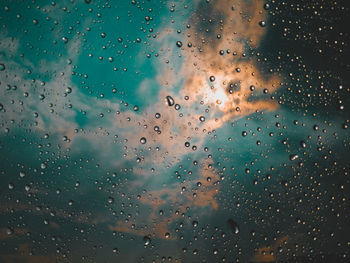 Full frame shot of raindrops on glass window