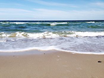 Scenic view of beach against sky