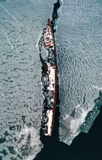 High angle view of snow by sea